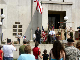 Senator Mike Williams speaks in front of the Union County Courthouse on Memorial Day 2007, which VFW #8682 Post Commander Bill Rollins looks on