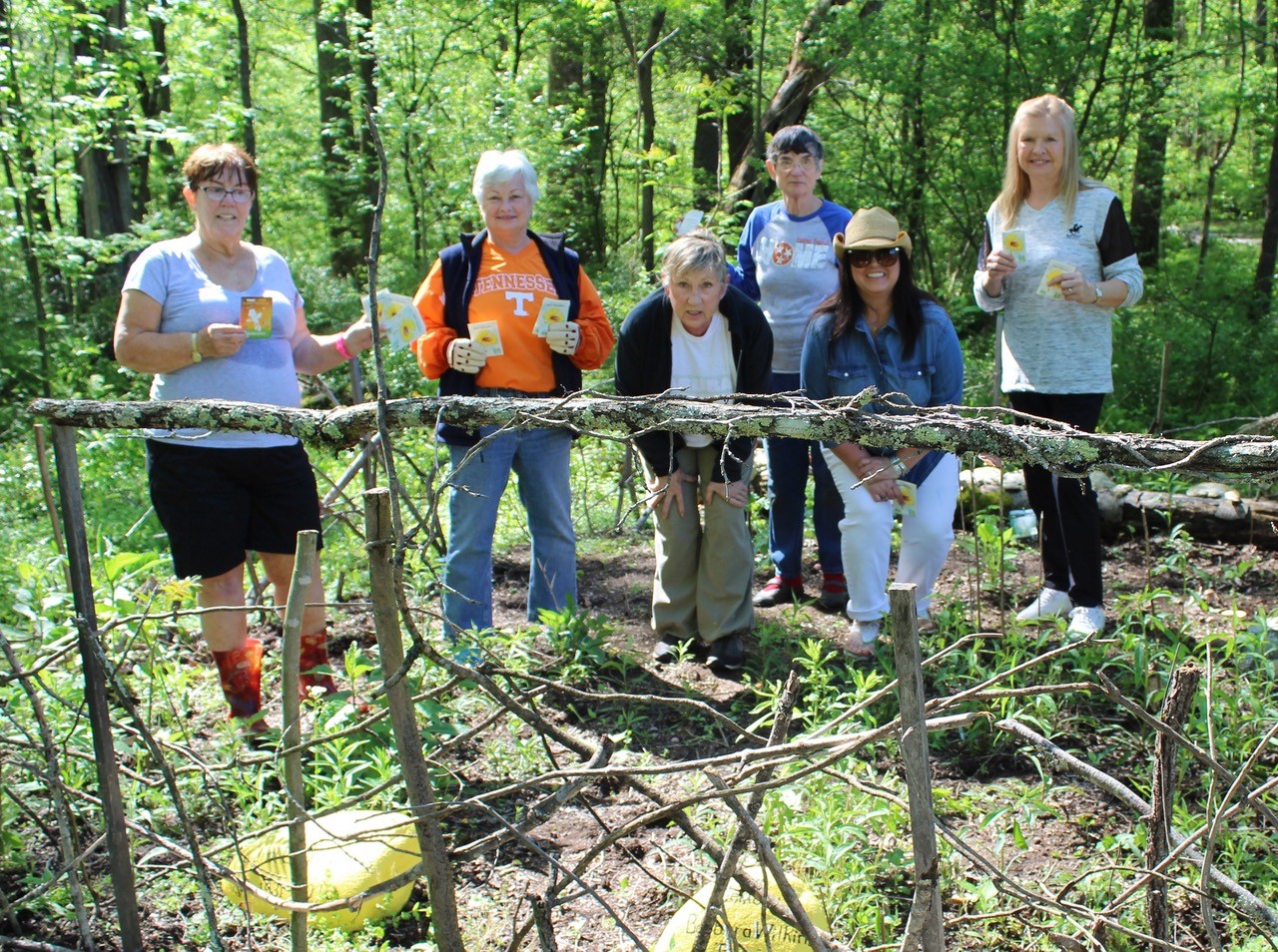 Chapter members planting trees and seeds for Arbor Day