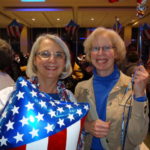 Eleanor Meisenheimer and Suzanne Graham greet veterans on return from Washington D.C.