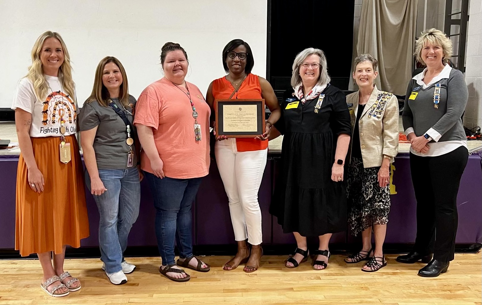 Presenting a NSDAR Americanism to the faculty and students of Coopertown Elementary School for their activities for Veterans.