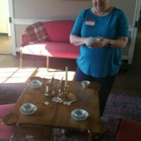Day of Service at Blount Mansion dusting furniture