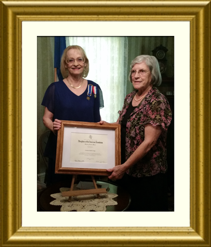 Kathleen Cannon presents Carolyn Gregg with DAR History Award Medal