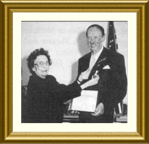 Elizabeth Tallent, History Chairman or the Nolachuckey Chapter, presents Mr. Richard Doughty with the NSDAR National History Award Medal